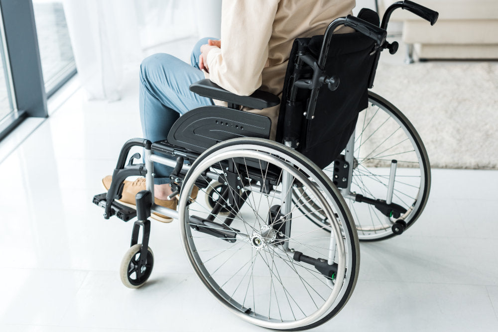 man sitting in modern wheelchair