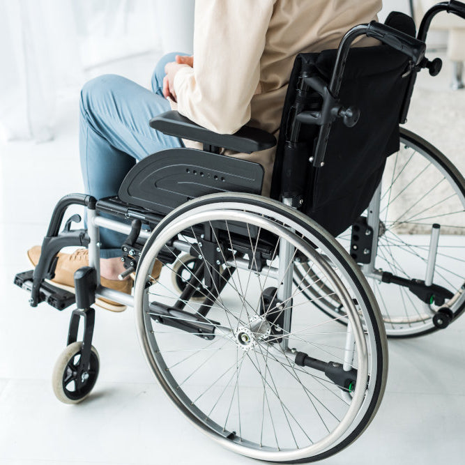 man sitting in modern wheelchair