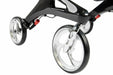 Close-up of the large front castors and carbon fibre frame of a Hero Medical Outdoor Lite Walker with silver multi-spoke wheels
