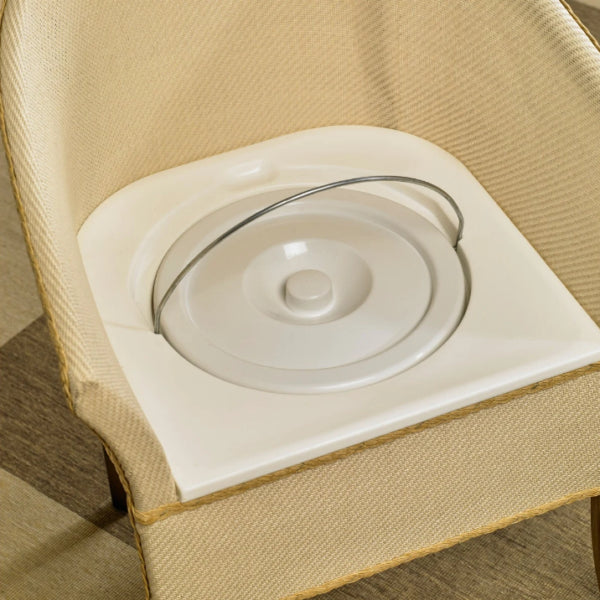 Close-up of wicker commode chair with bucket and lid