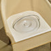 Close-up of wicker commode chair with bucket and lid